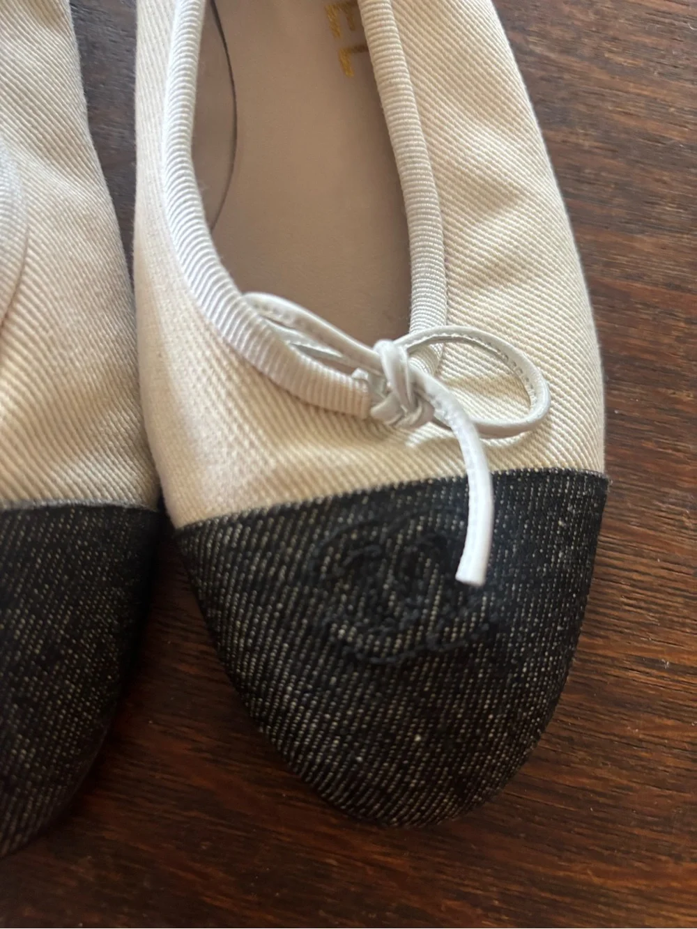 CHANEL Ivory Canvas Ballet Flats with Black Cap Toe and Bow